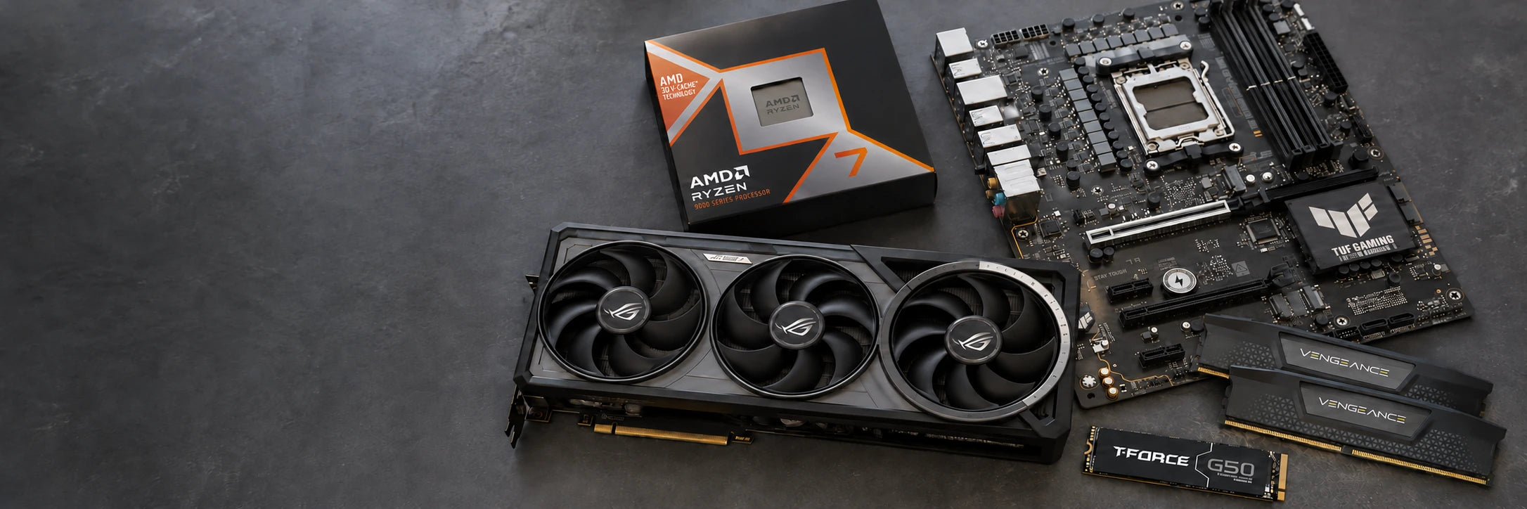 Graphics card, processor, motherboard, memory and SSD on a dark work surface
